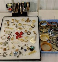 Group of bracelets, and many brooches and pins