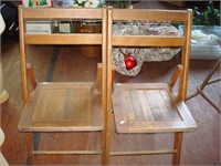 2 wooden folding chairs
