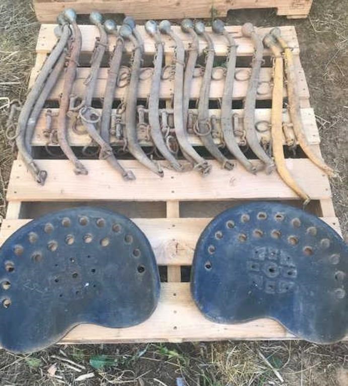 15 Harness hames & 4 tractor seats on pallet