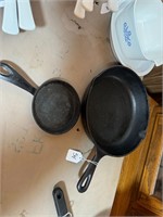 2 cast iron skillets, large 10"and smaller