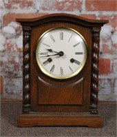 A German Bracket Clock in oak case, 8 day brass
