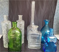 Assorted bottle vases.