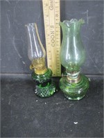 2 small green oil lamps