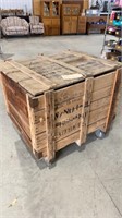Wood shipping crate on large casters