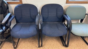 2 blue arm chairs