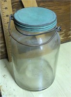 Jar with blue lid and bail
