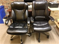 Pair of used black leather office chairs