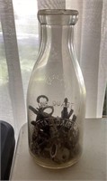 Vintage keys in milk bottle