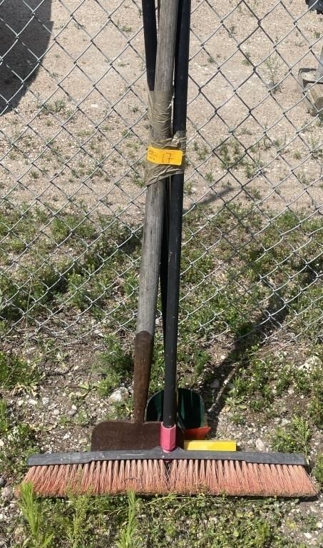 A broom, squeegee, ice chiller and a mini hole