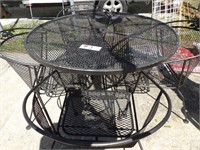 wrought iron patio table and 4 chairs