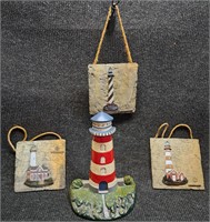 CAST IRON LIGHTHOUSE DOOR STOPPER & 3 WALL PLAQUES