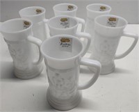 7 Milk Glass Steins