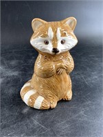 Ceramic raccoon figurine signed by artist with hol