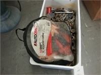 Tub of old screws and bolts with jumper cables.
