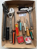 pipe wrenches, knives, screwdrivers, tape measurer