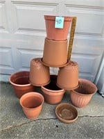 Several plastic plant pots