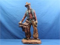 Ceramic Cowboy w/Saddle Statue