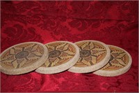 Lot of four sandstone coasters