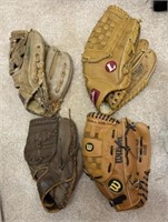 Four Baseball Gloves