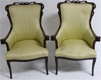PAIR OF ORNATELY CARVED MAHOGANY ARM CHAIRS,