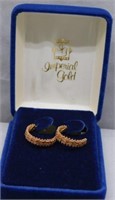 Pair of 14K yellow Gold hoop earrings. Weight 3.3