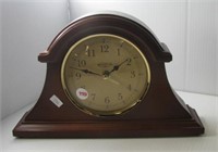 Brownstone wood mantle clock. Measures 7.5" h x