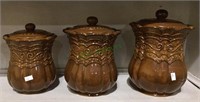 Very nice set of three ceramic canisters - largest