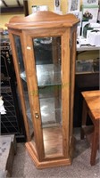 Curio cabinet with two glass shelves and one