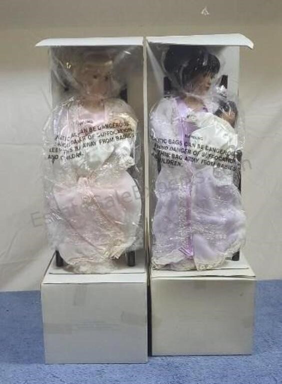 Avon porcelain dolls with stands. NIB. Some water