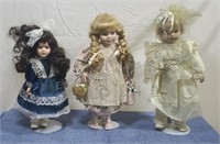 Porcelain dolls with stands. No boxes