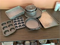 3 cookie sheets, pizza pan, muffin tins,