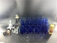 Large collection of cobalt blue glasses, a tea lit