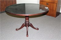 Round Mahogany toned table 47" x 31"
