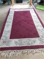 A beautiful red and white flower print rug