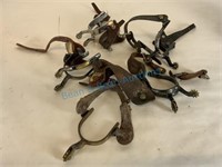 4 1/2 pairs of iron spurs