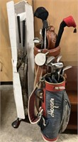2 Sets Of Golf Clubs.