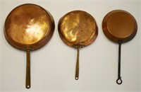 Three old copper fry pans