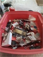 Pink tub of miscellaneous hardware items