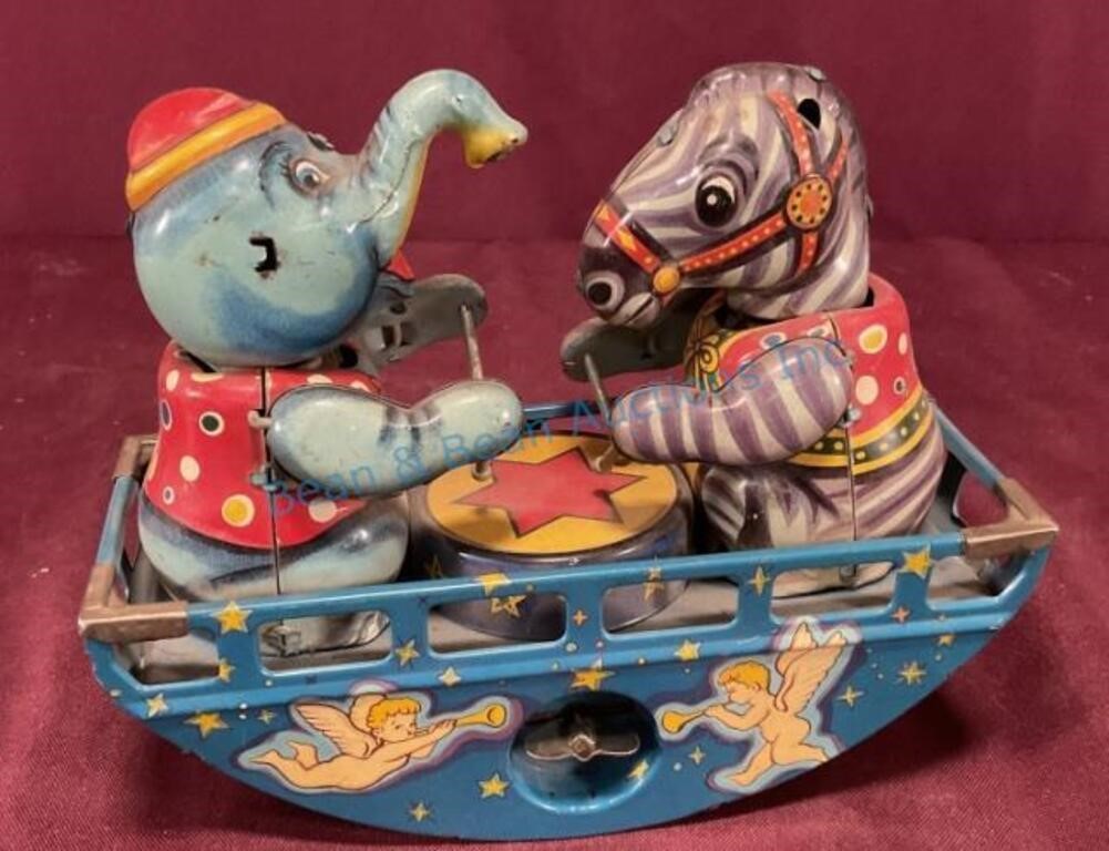 Tin windup elephant and zebra toy