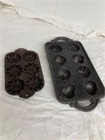 2 cast iron moulds.