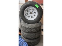(4) CHEVY TIRES AND RIMS 5 HOLE; WILDCAT LT ALL TE