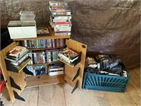 wood cabinet, cds. vhs tapes, dvds cd in crate,