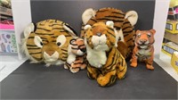 Five Tigers, four stuffed and one battery