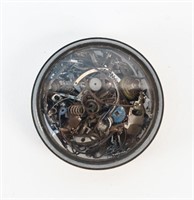 WATCH PARTS IN SILVER AND GLASS CASE