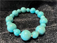 TURQUOISE COLORED BRACELET