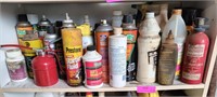 Shelf of assorted lubes, starting fluid, engine