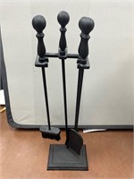 Four piece cast iron fireplace accessories