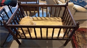 Antique wooden crib, with four permanent sides,