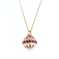 A Lady's Ruby and Diamond Pendant in 14K