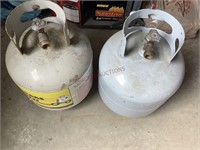 One Empty and One Half Full Propane Tanks